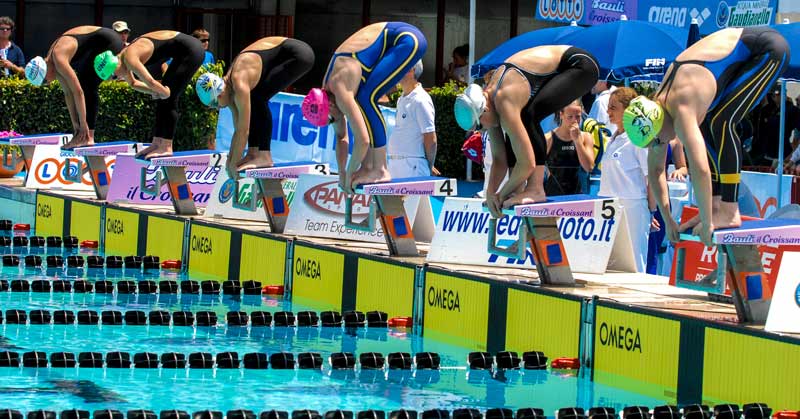 Female Swimmers in Starting Blocks