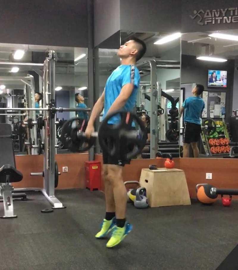 Squash Player Lifting Weights