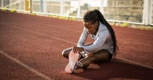 Female Sprinter Stretching