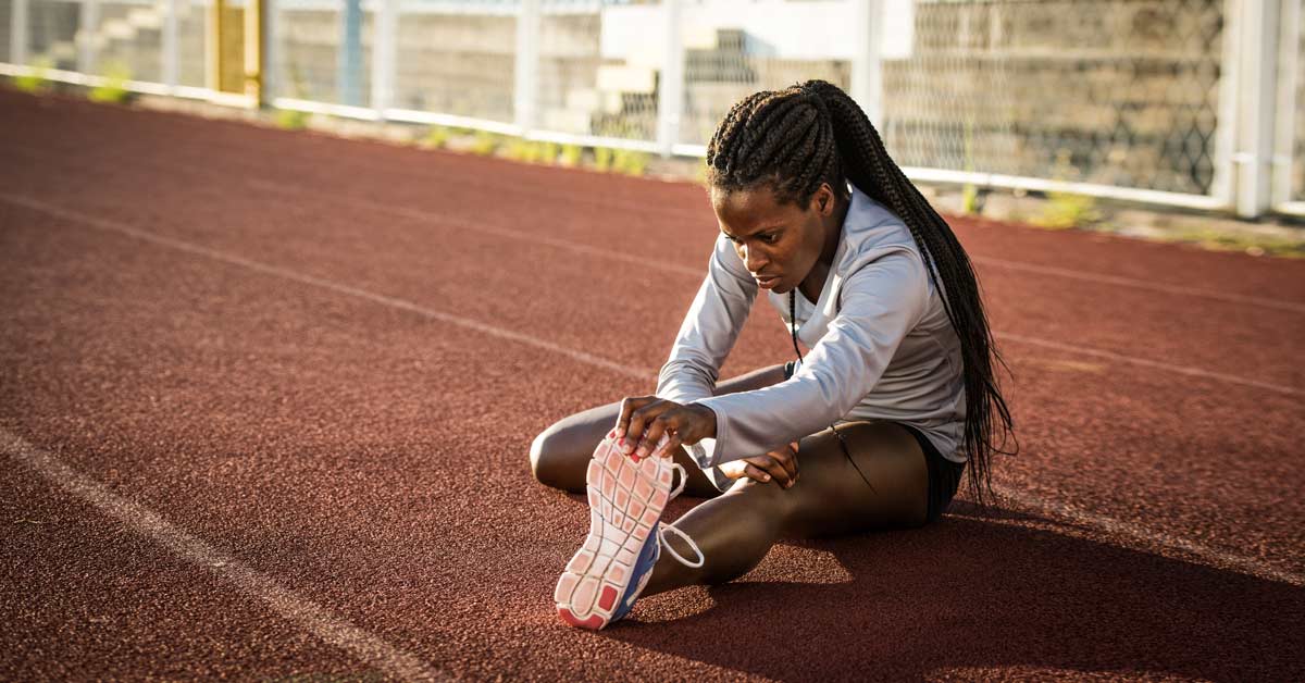 Female Sprinter Stretching