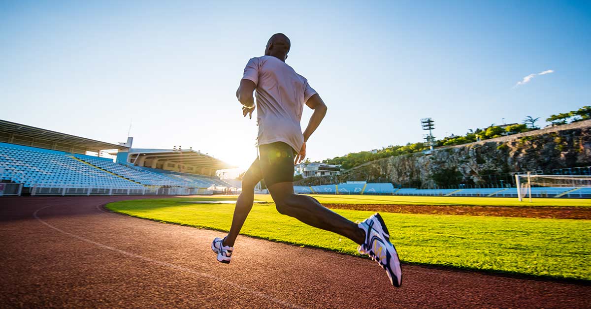 Male Athlete Running Track