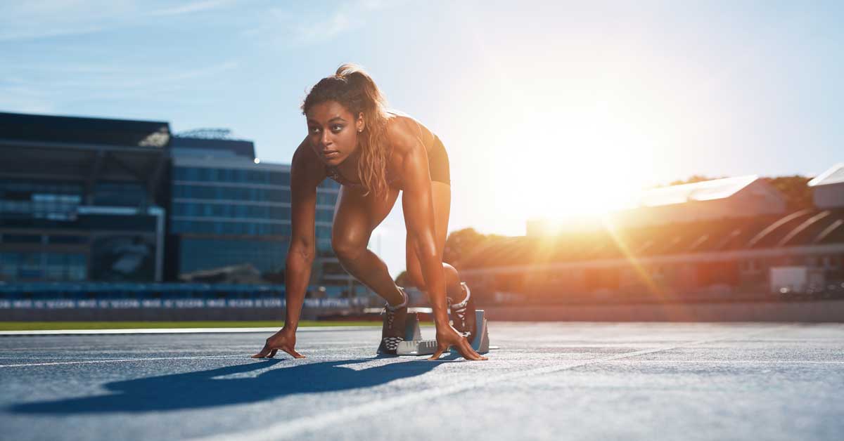 Female Sprinter in Starting Blocks