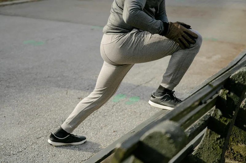 A calf stretch using a bench.