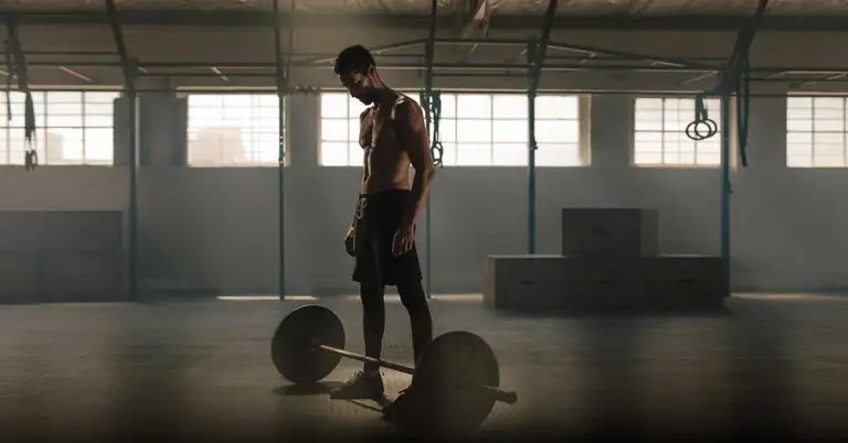 Athlete with barbell|A Strength for Speed workout sheet for mass-specific force