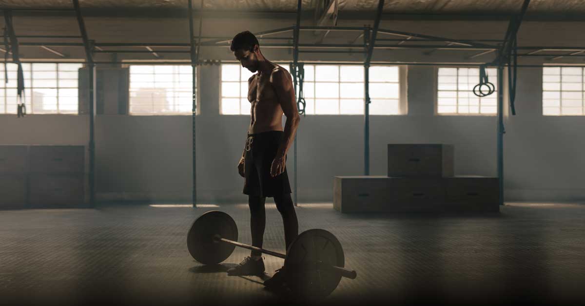 Athlete with barbell|A Strength for Speed workout sheet for mass-specific force