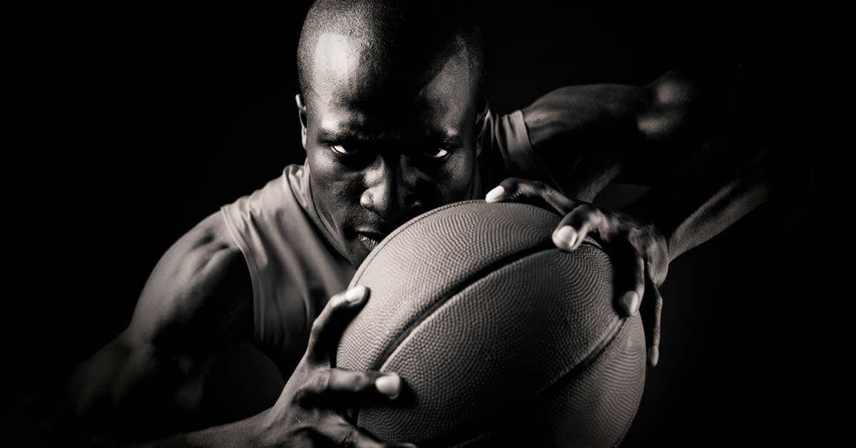 Baskeball Player with Ball|Omegawave HRV|Coop Lifting|Omegawave-Athlete-Assessment|Preparedness Curve|Tablet display showing an app interface with a profile of a user named John Smith. The screen features a line graph labeled Central Nervous System - DC Curve