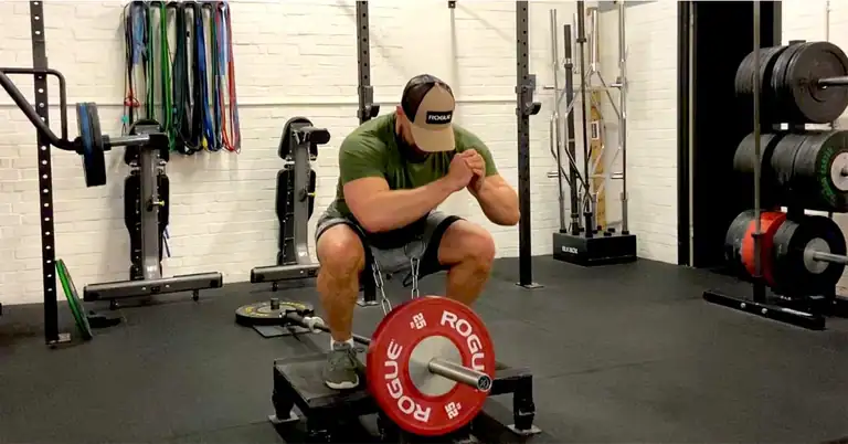 Belt Squat|A table titled Primary Exercises Approach outlines a three-day exercise regimen. Day 1 and 3 focus on conventional barbell movements