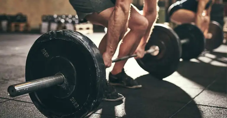 Biomechanics Program Design|Exercise Taxonomy|Load Velocity Duration Chart|Coach in gym cueing his athlete's lifts.|Coaching Biomechanics|Barbell Deadlift Chart|Split Squat Chart|Rotational Medicine Ball Chart