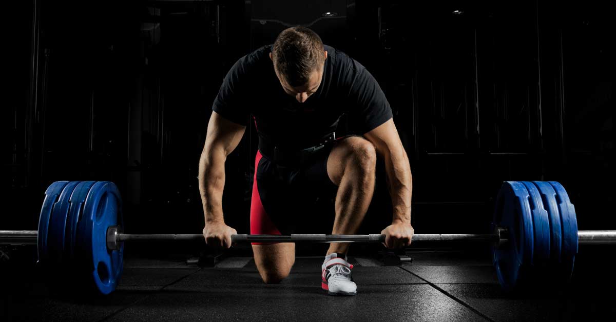 Central Fatigue|A person kneels on a gym floor