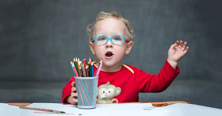 Child Sitting at Desk
