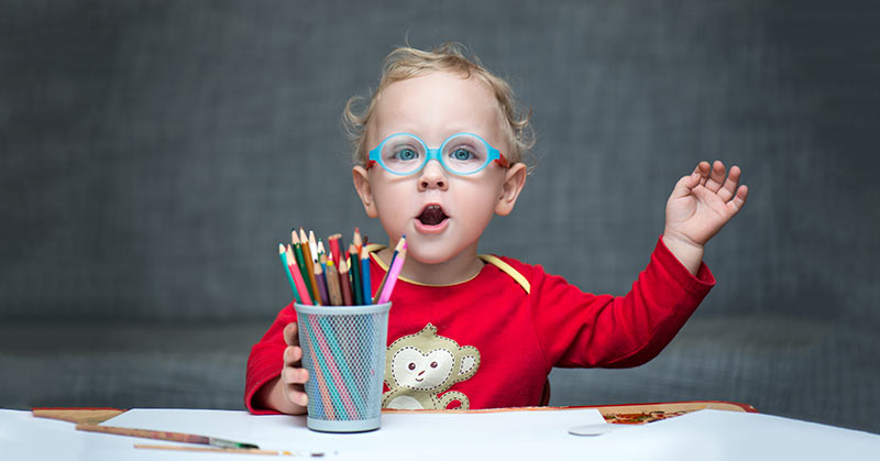 Child Sitting at Desk