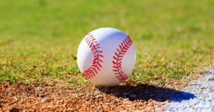 Dechant Baseball|TCU Baseball|Blood Flow Conditioning|A person in a purple TCU shirt exercises indoors