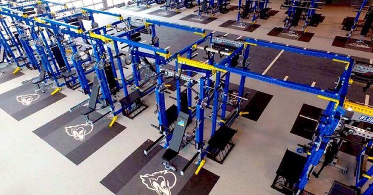 Delaware Weight Room|Chart titled University of Delaware Football Load-Velocity Profile displaying a line graph with data points and a trend line. Tables show statistical summary and velocity zones in various colors. Data interpretation section at the bottom.|Data Collection
