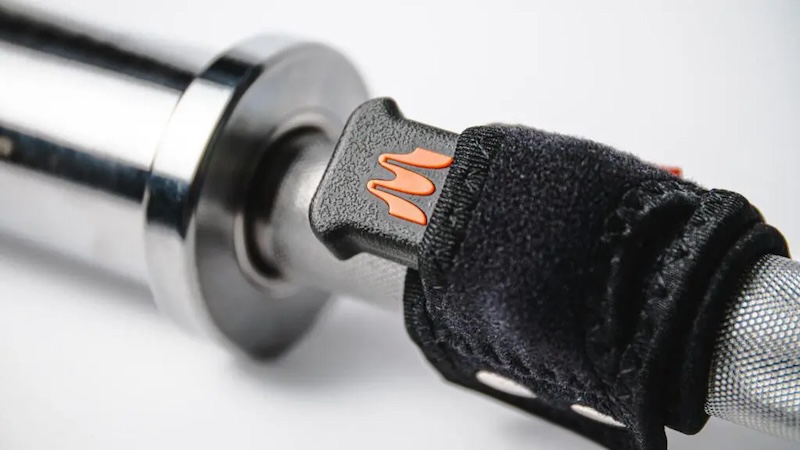 The Enode Pro inside the Enode barbell strap.