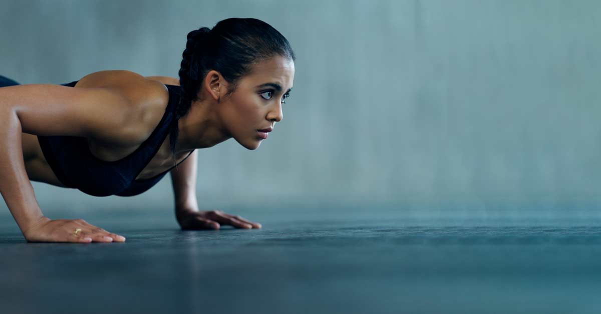 Female Athlete Performing Push-ups