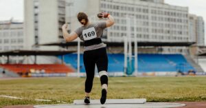 Female Shot Put|Aikens Video Analysis|Two images show a person practicing discus throwing. Text describes techniques: maintaining alignment