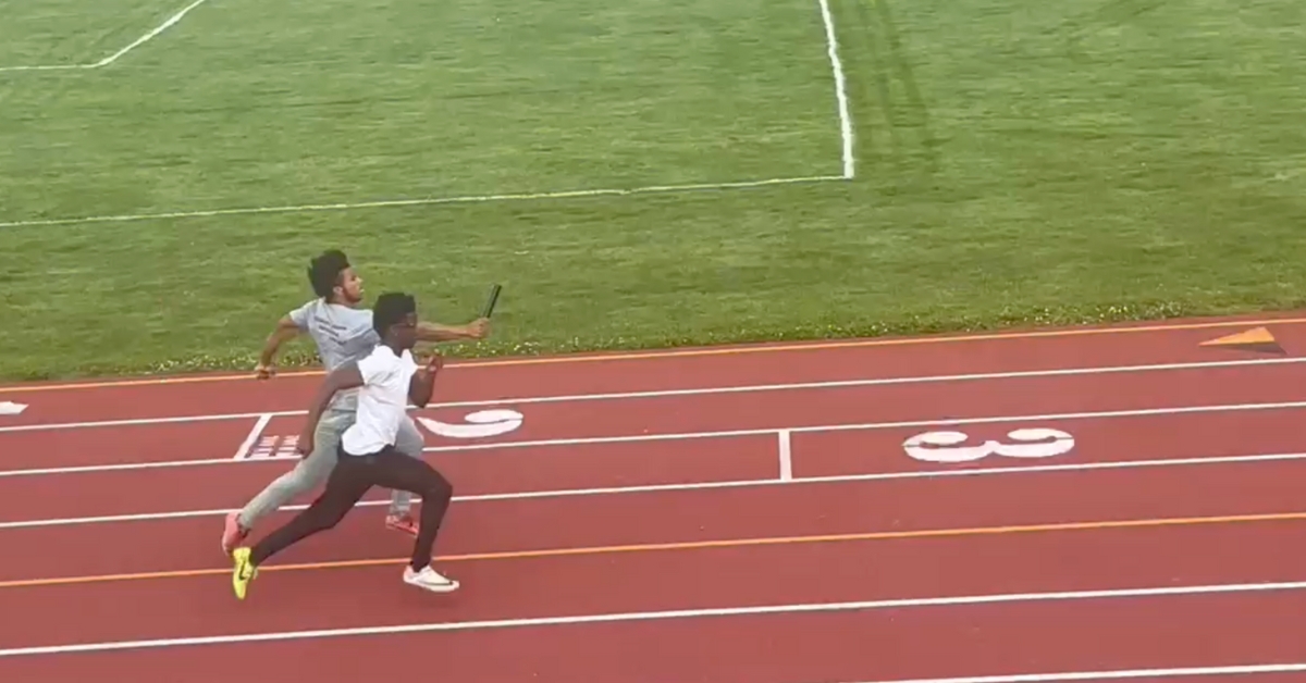 Two athletes sprint on a track