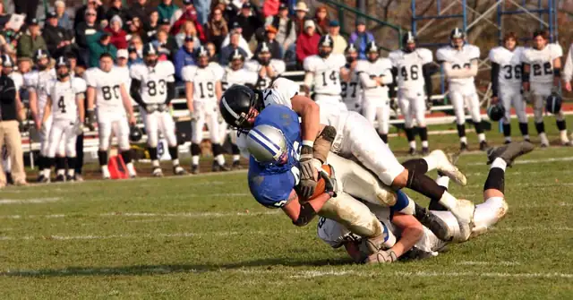 Football Tackle|A pair of medical compression leg sleeves are laid out on a table. The sleeves