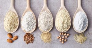 Gluten-free|Five wooden spoons lined up on a surface