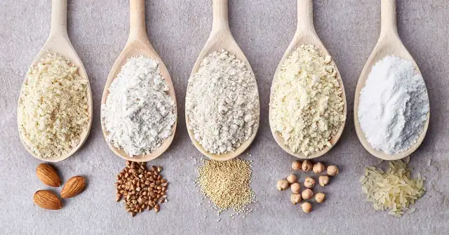 Gluten-free|Five wooden spoons lined up on a surface