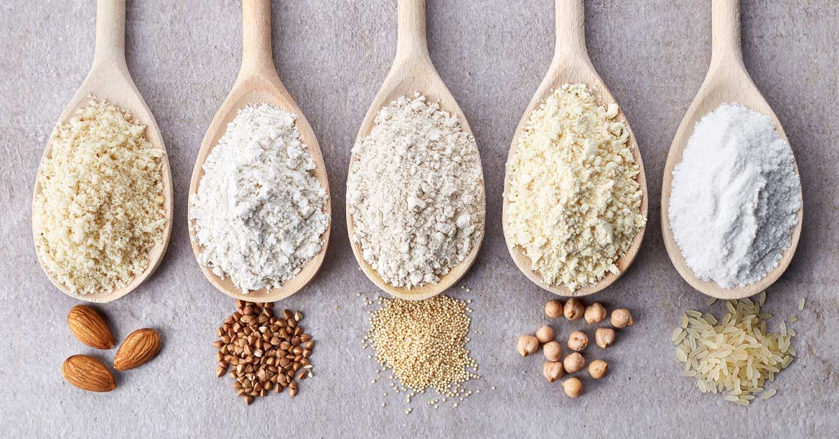 Gluten-free|Five wooden spoons lined up on a surface