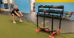 A man exercises in a gym