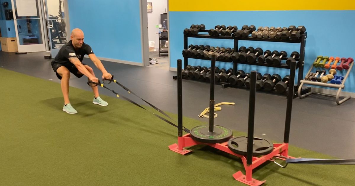A man exercises in a gym