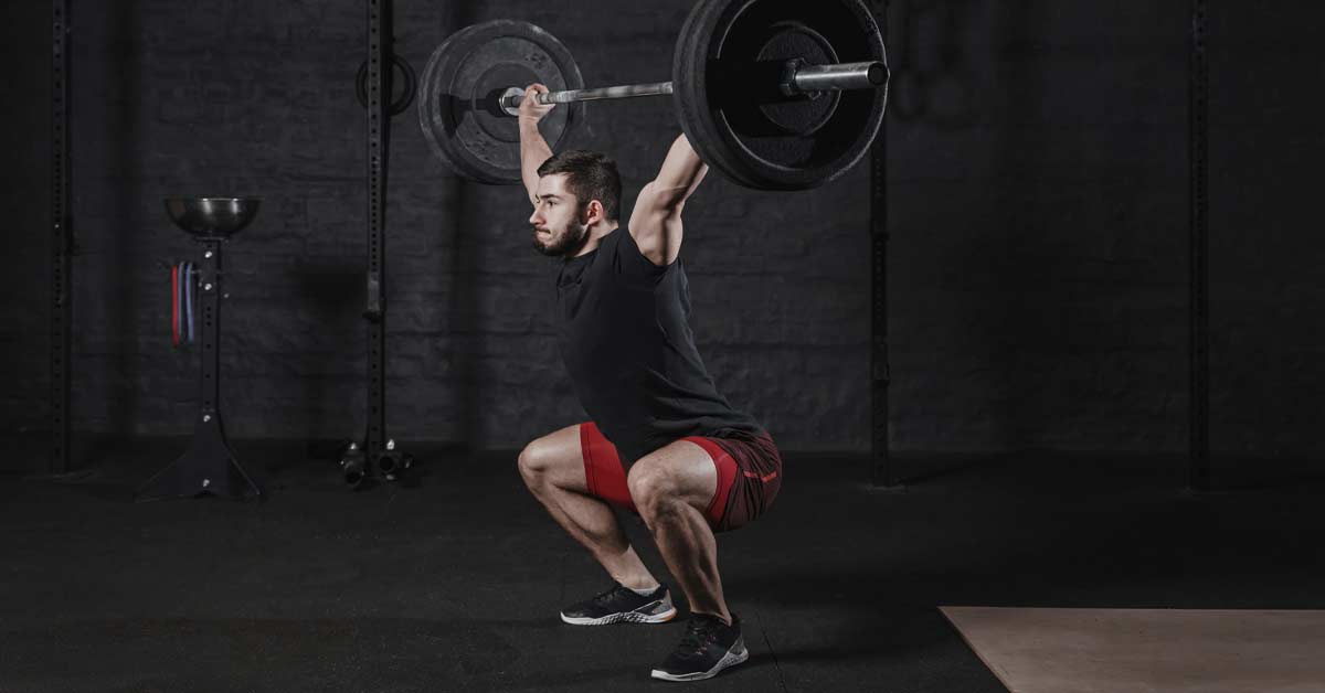 Overhead Squat|A person performs an overhead squat next to a list of common constraints