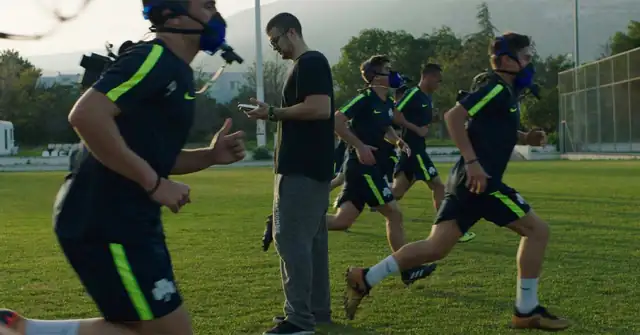 PNOE Athletes|PNOE Cones|PNOE Academy Soccer|A person with short dark hair and a beard is facing the camera