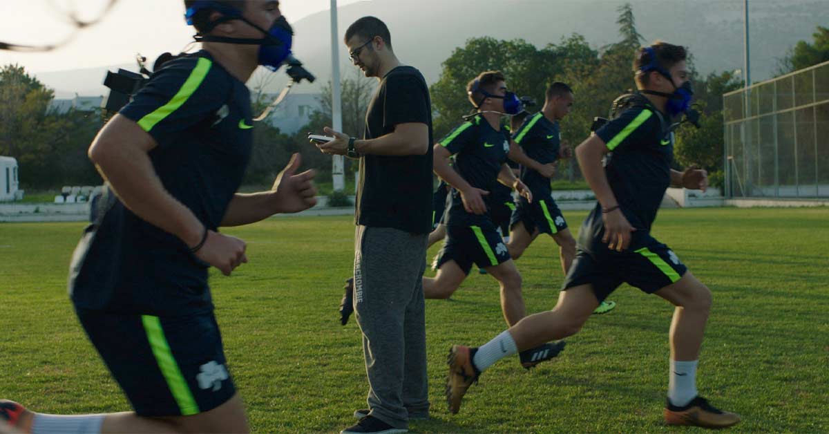 PNOE Athletes|PNOE Cones|PNOE Academy Soccer|A person with short dark hair and a beard is facing the camera