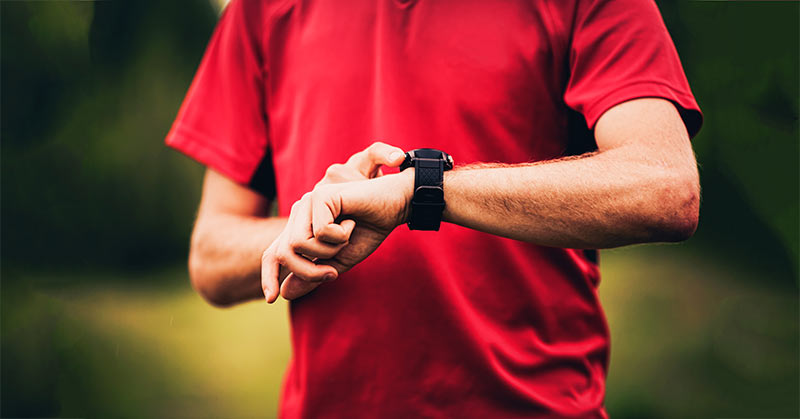 Runner wearing heart rate monitor