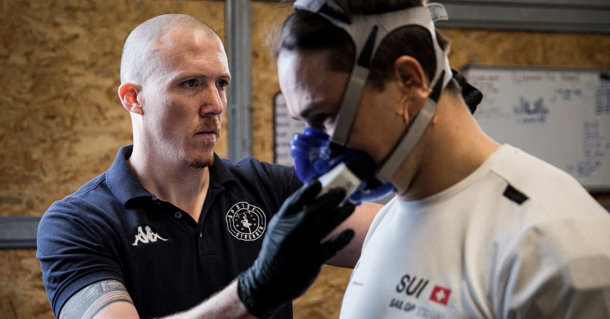 Athlete Profiling|Thresholds|Moderate to Extreme|Athlete Differences|Thresholds and Zones|Athlete Testing|Grueling Test|Critical Power|Spirometry|4-1 Step Test|Analyzing Results|Treadmill Test|VO2 Master Fitting|Moxy Rower|Lactate Test|RPE Scale|Poor Results|Moxy Data|Rowing Step Test|Forearm Step Test|Intensity Prescriptions|HR Test|VO2 Master Ride|Spirometry Results|A person in athletic wear sits on a bench at a track