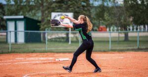 Softball Pitch|C In Back|Neck Stabilizer|Three images of a woman demonstrating a golf swing issue titled Problem #3: Using Only the Arms for Rotation. Arrows indicate improper arm movements. Bright yellow background with She Strength logo in the corner.