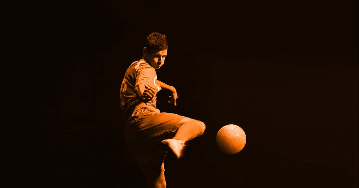 A soccer player in mid-air