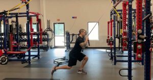 Tightness Stretching|Tightness Massage|A person in athletic wear performs a side stretch in a gym. On the left