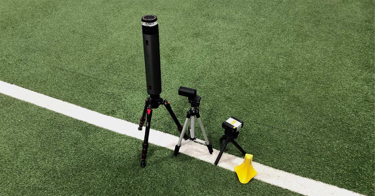 Timing Systems|Smart Speed Timing|Move Sensor|A velocity measurement device on a tripod is positioned next to a display with graphs. The graphs show velocity