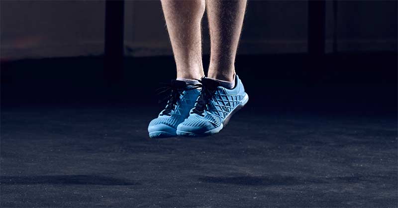 Vertical Jump Testing|Force Plates|Vertec Vertical Jump Flags|Force-Time Curve|Jump Height Muscle Lab|Hawkin Dynamics Force Plate Metrics|A person in athletic clothing stands in a gym