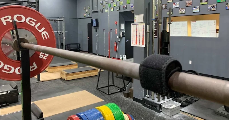 The Enode Pro strapped to a barbell.