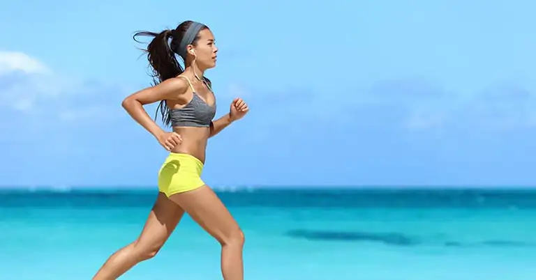 Woman Exercising on the Beach