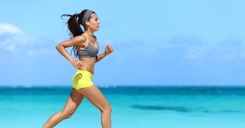 Woman Exercising on the Beach