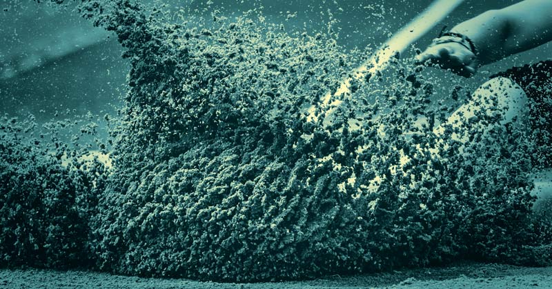 Long Jump Sand Pit|A runner in a crouched starting position on a track